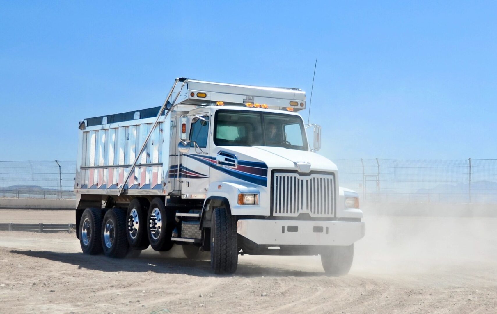 A truck on the sandy field