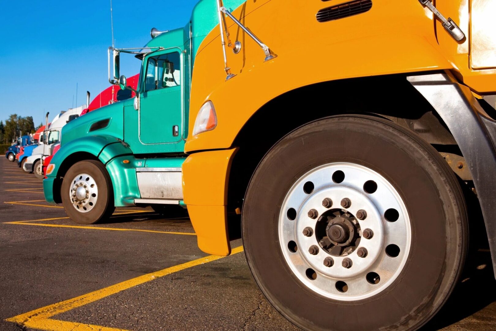 Trucks with different colors lined on a parking lot