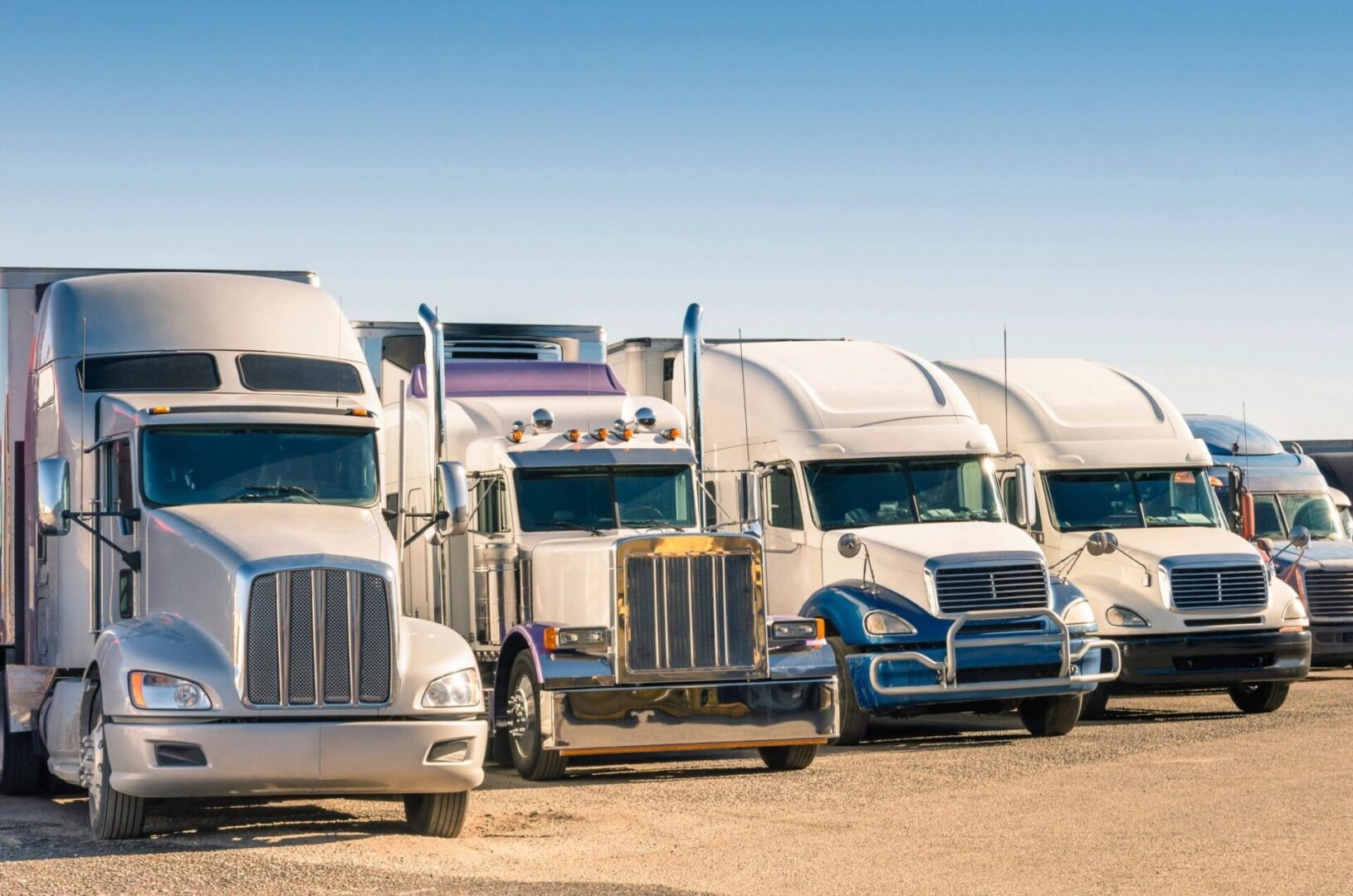 White trucks parked on a lot